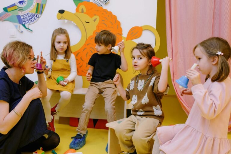 A group of young children engaged in imaginative and interactive play in a colorful, whimsical classroom environment.